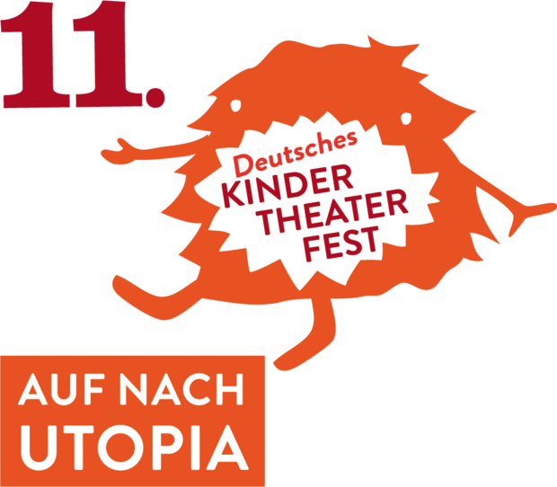 DKTF Maskottchen mit großer elf und "Auf nach Utopia" Schriftzug